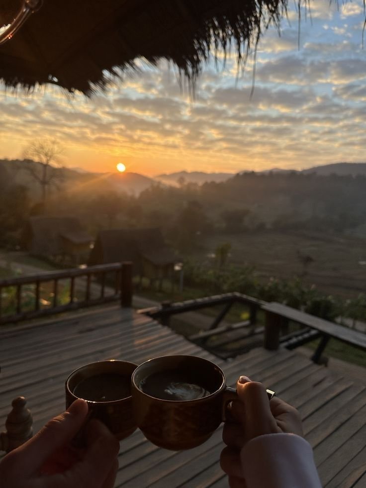 Sharing morning coffee on the veranda at sunrise