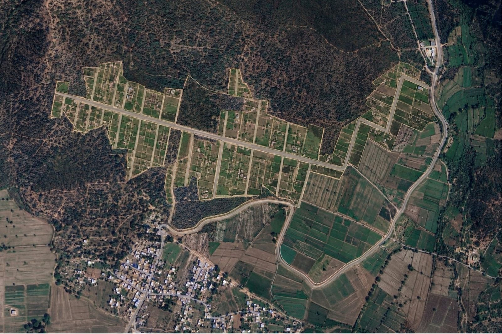 Aerial survey of Echoes Farmhouses showing the plotted land parcels among the hills and farms
